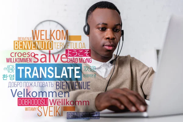 African american interpreter in headset near laptop, translate lettering near words in foreign languages. Translation: 