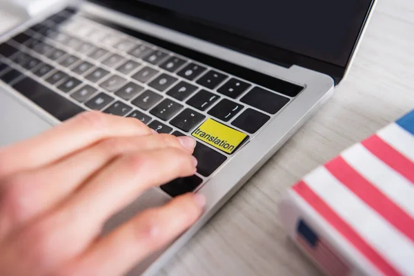 Partial view of interpreter pressing translation key on laptop, selective focus — Stock Photo