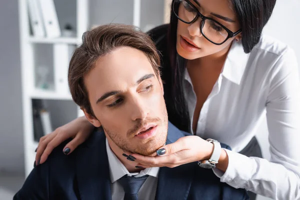 Passionate secretary touching businessman while seducing him in office — Stock Photo