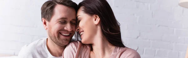 Cheerful adult woman near husband at home, banner — Stock Photo