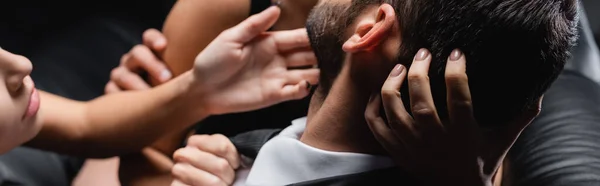 Cropped view of passionate women seducing businessman, banner — Stock Photo