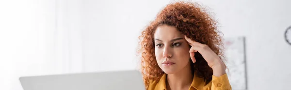 Thoughtful woman with wavy hair working at home, banner — Stock Photo