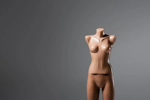 Plastic mannequin isolated on grey with copy space — Stock Photo