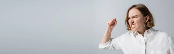 Irritated overweight woman in white shirt isolated on grey, banner — Stock Photo