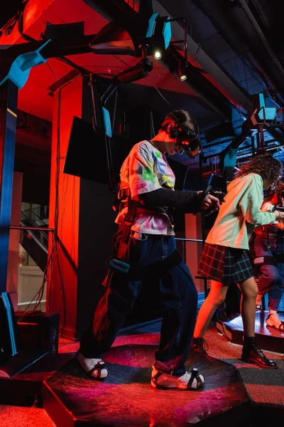 Interracial teenagers gaming on vr platform in play zone — Stock Photo