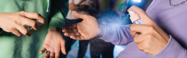 Partial view of teenage gamers applying hand sanitizer, banner — Stock Photo