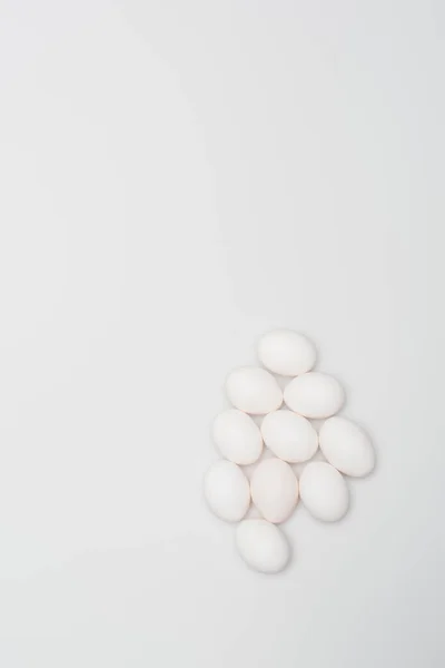 Top view of oval and organic eggs isolated on white — Stock Photo
