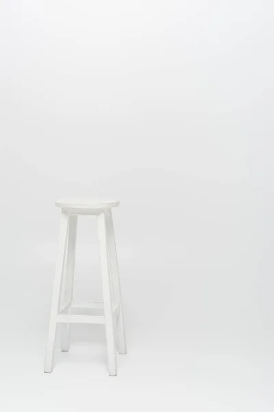 High wooden stool on white background — Stock Photo