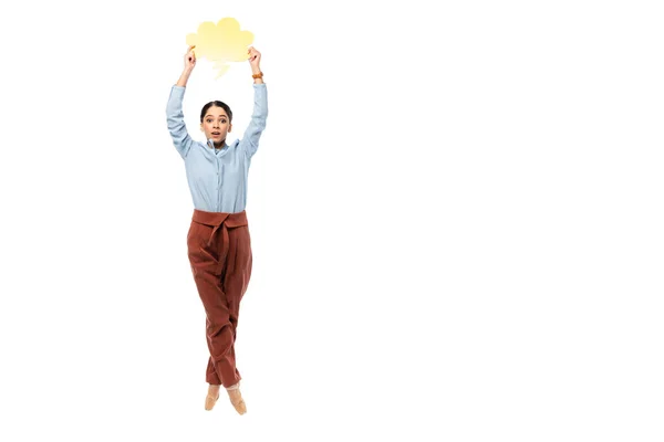 Ballerina holding speech bubble and looking at camera isolated on white — Stock Photo