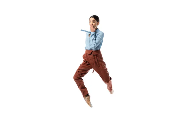 Astonished ballerina jumping isolated on white — Stock Photo