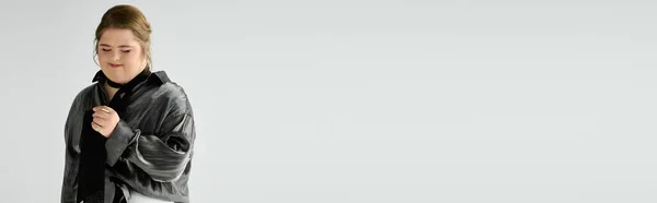 Brightly dressed young woman with Down syndrome enjoys a moment of bliss and confidence. — Stock Photo