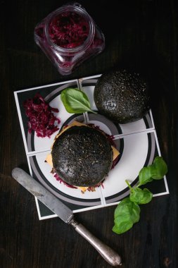 Black burger with stews clipart