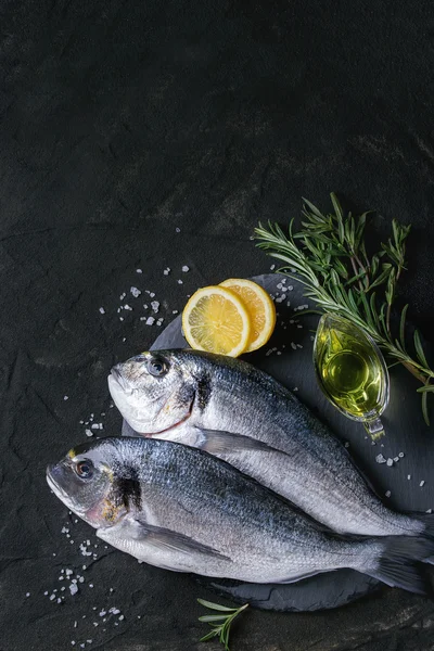 Raw bream fish with herbs — Stock Image Raw bream fish with herbs Stock Image