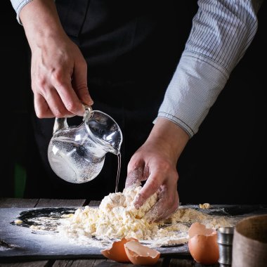 Knead the dough by female hands