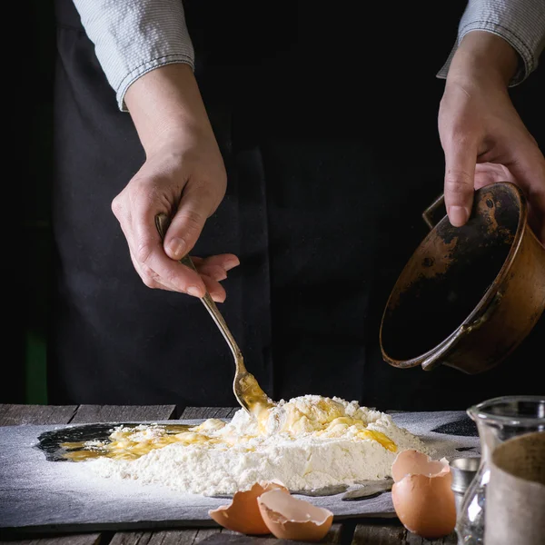 Knead the dough by female hands — Stock Fotó