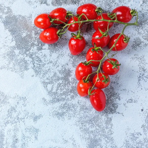 Cherry tomatoes over white — Stock Photo, Image