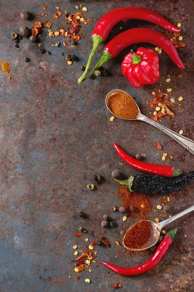 Spicy background with chili peppers — Stock Photo, Image