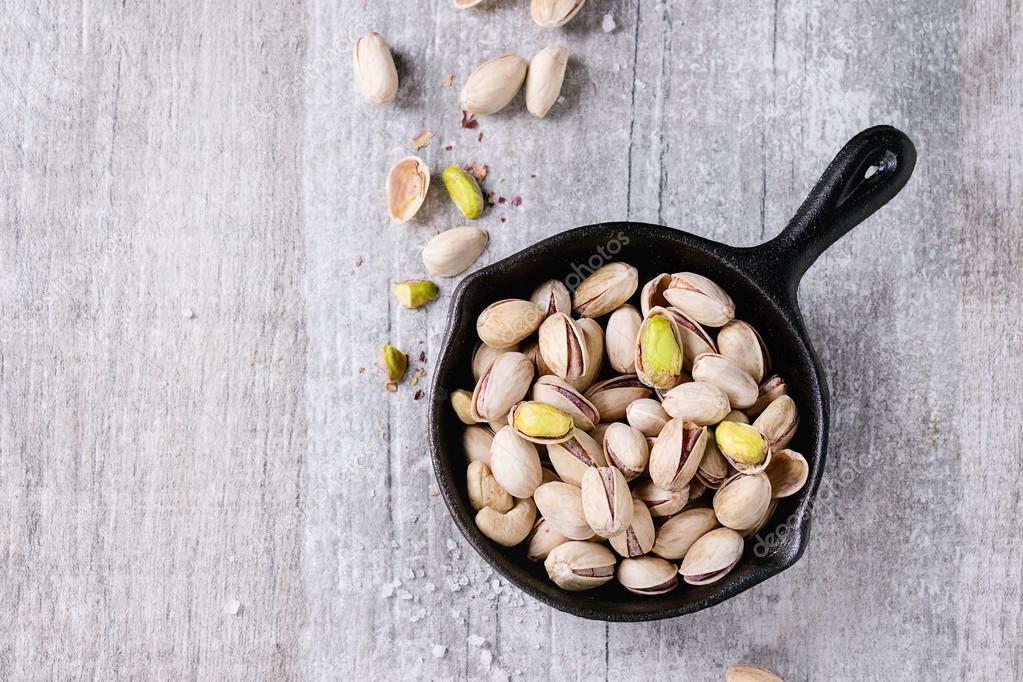 Salted roasted pistachios Stock Photo by ©NatashaBreen 111146300