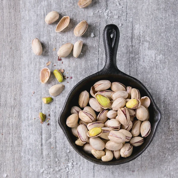Salted roasted pistachios Stock Photo by ©NatashaBreen 111147094