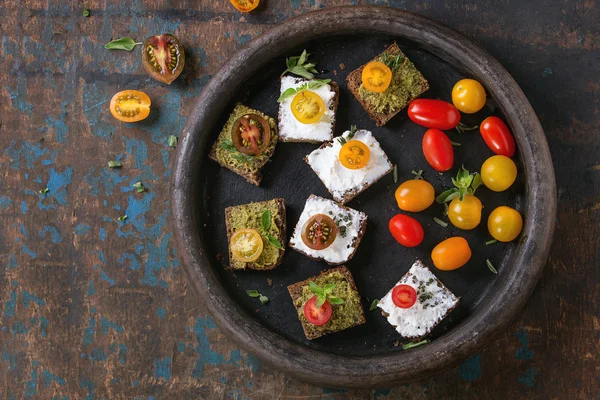 Small sandwiches with tomatoes — Stock Photo, Image