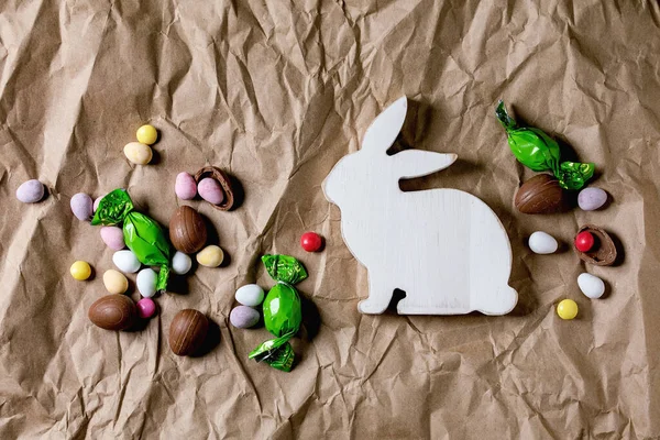Easter Greeting Card Wooden Rabbit Decorations Chocolate Sweets Eggs Crumpled — Stock Photo, Image