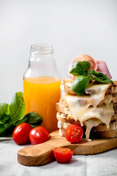 Stockpile Toasted Melted Cheese Pressed Sandwiches Ham Meat Cherry Tomatoes — Stock Photo, Image