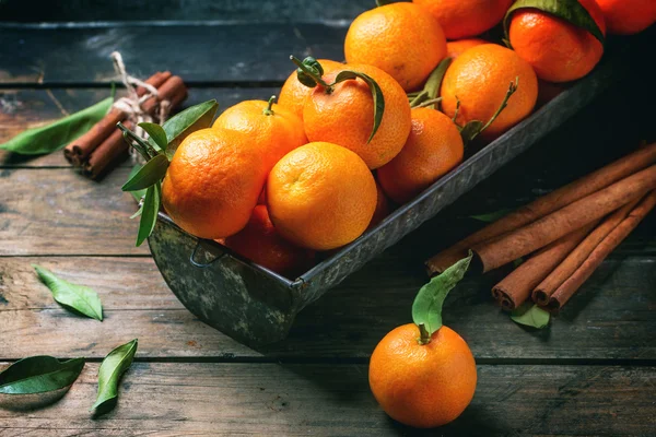 Tangerines with cinnamon — Stock Photo, Image