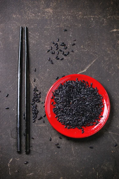 Black rice with chopsticks — Stock Photo, Image