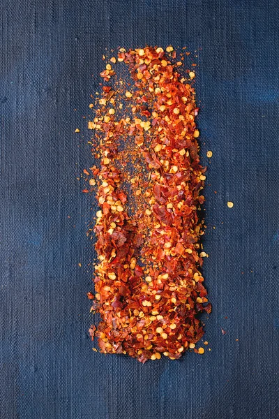 Flakes of red hot chili peppers — Stock Photo, Image