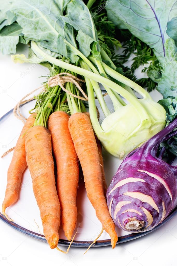 Bundle of carrots and kohlrabi — Stock Photo © NatashaBreen 79675496