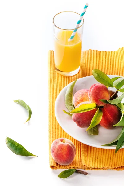 Peaches on branch and juice