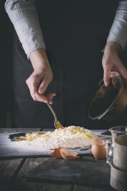 Knead the dough by female hands