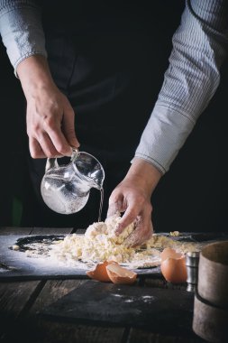 Knead the dough by female hands