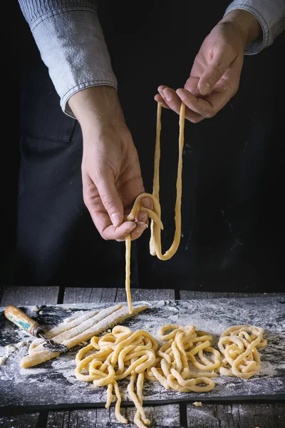 Making pasta by female hands — Stock Photo, Image