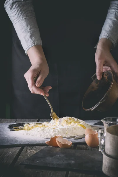 Knead the dough by female hands — Stock Fotó