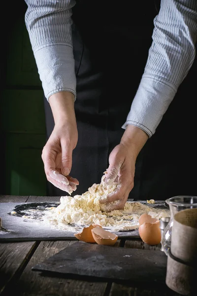 Knead the dough by female hands — Stock Fotó