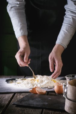 Knead the dough by female hands