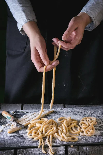 Making pasta by female hands — Stock Photo, Image