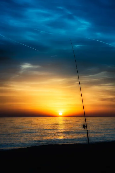 Canne à pêche au coucher du soleil — Photo