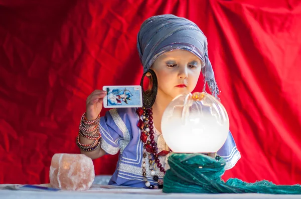 Little child plays to be a fortune teller — Stock Photo, Image