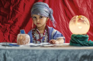 little child plays to be a fortune teller clipart