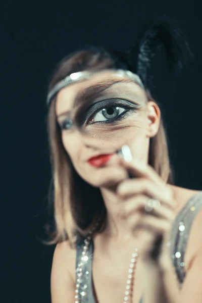 Woman looks through the lens — Stock Photo, Image