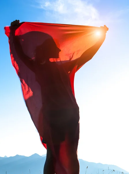 Silueta og una joven con sábana roja —  Fotos de Stock