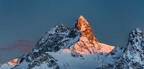 Snowy mountains with last sun summit — Stock Photo, Image