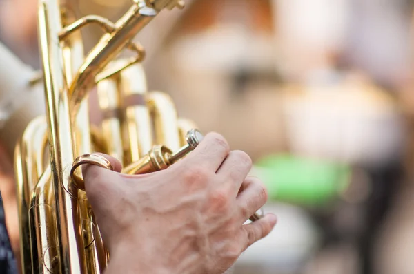 Detail on a hand plays tuba — Stock Photo, Image