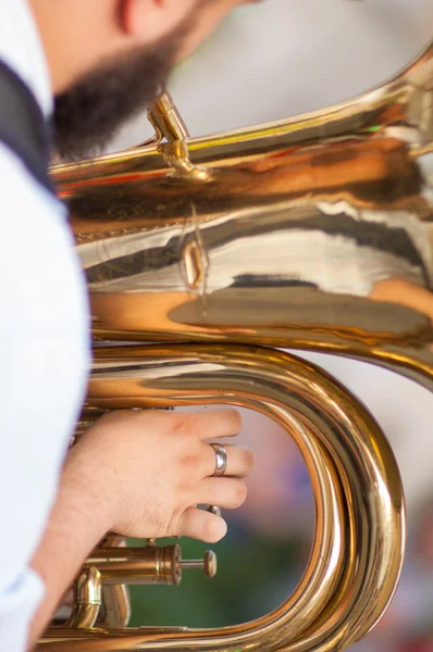 Detail on a hand plays tuba — Stock Photo, Image