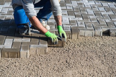Worker paving stones clipart