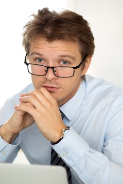 Portrait of frustrated business man wearing glasses clipart