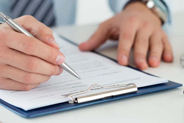 Close up of male accountant making calculations — Stock Photo, Image