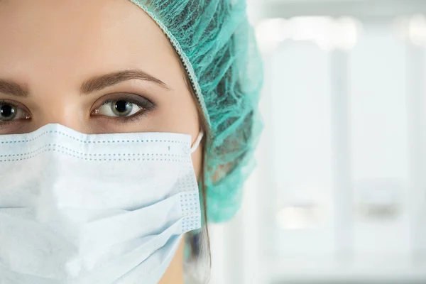 Close-up portrait of young female surgeon doctor — Stock Photo, Image